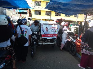 Loper Koran ini Sosialisasi Jokowi di Pasar Peunayong